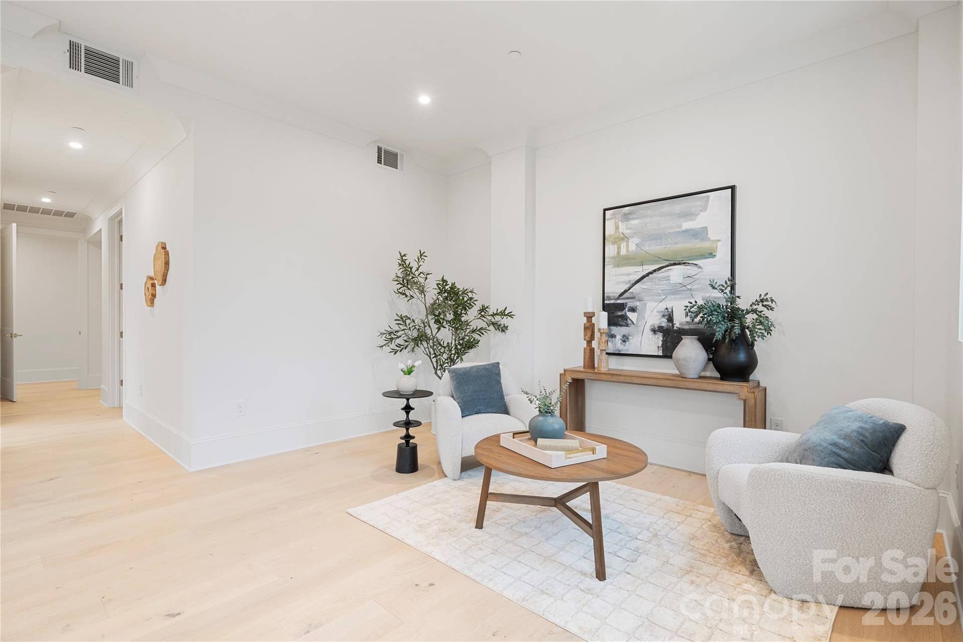 409 Queens Road, #503, Charlotte, NC 28207 Within the extraordinary primary bedroom, the extended sitting area provides a quiet retreat space for reading, and relaxing.