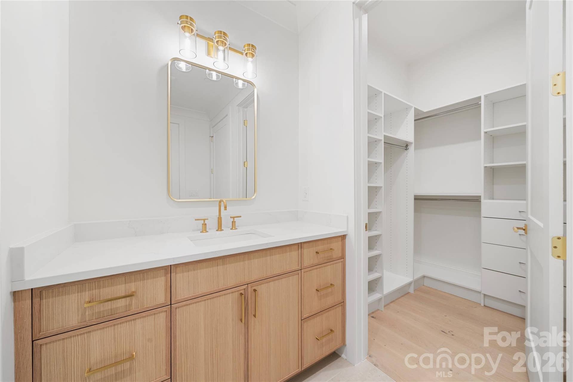 409 Queens Road, #503, Charlotte, NC 28207 A view of the spacious walk-in closet with built-in storage that is part of Bedroom 3.