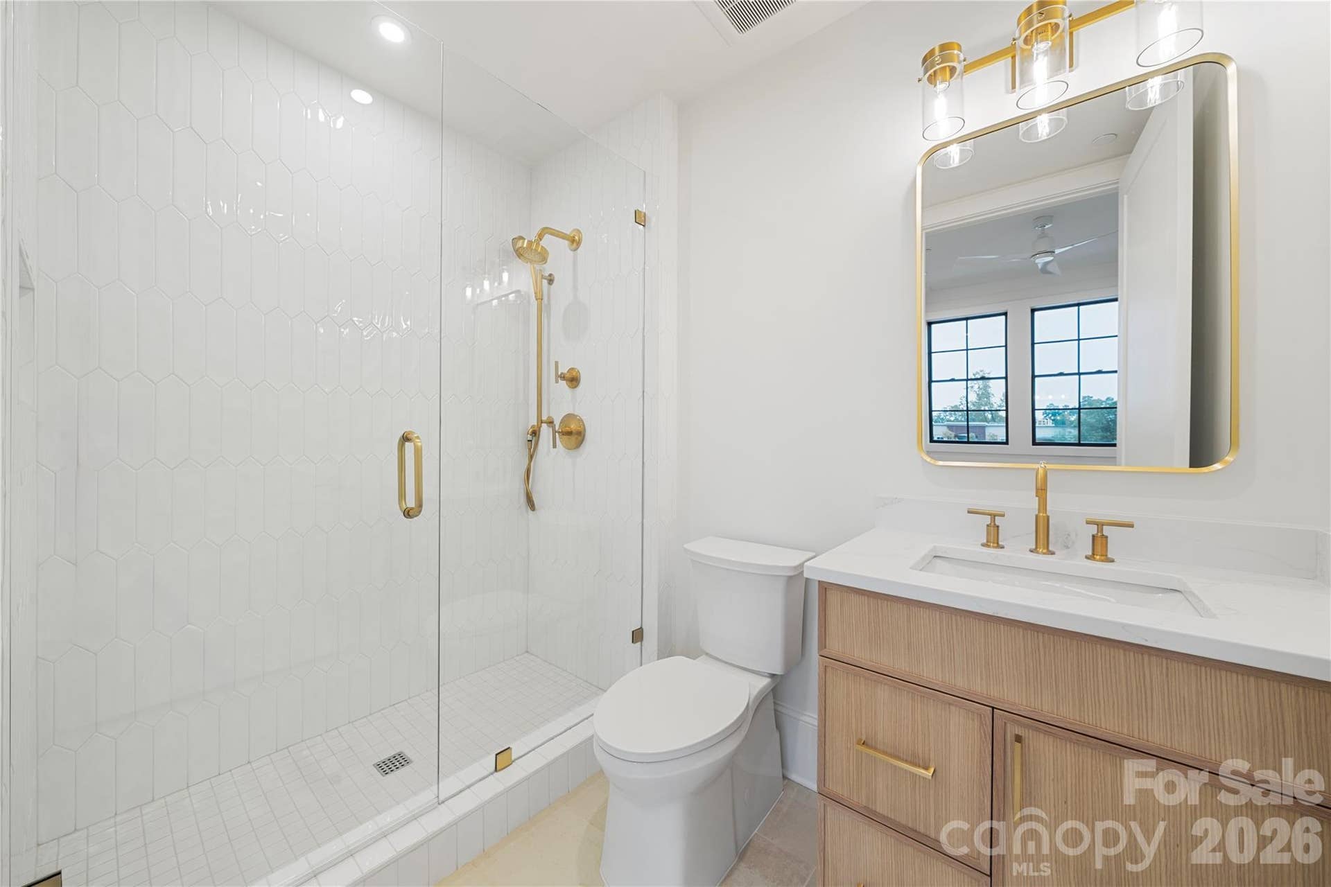 409 Queens Road, #503, Charlotte, NC 28207 Part of the Bedroom 2 suite, this bathroom provides a contemporary retreat with a large glass-enclosed shower and custom vanity.