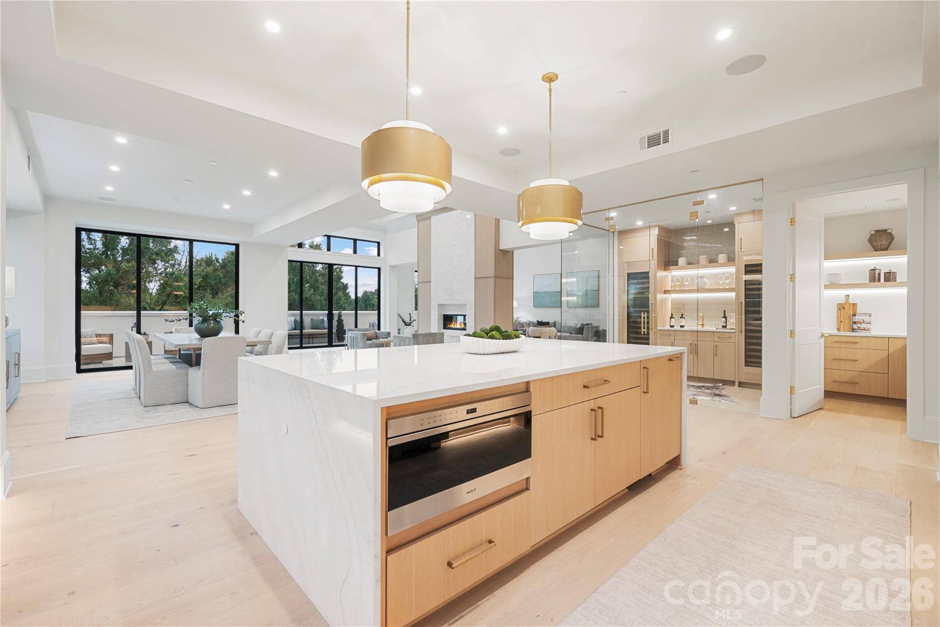 409 Queens Road, #503, Charlotte, NC 28207 The kitchen overlooks the family area, fireplace and terrace. And adjoining the kitchen is the glass-enclosed wine room and separate pantry, combining sophisticated design with exceptional function.