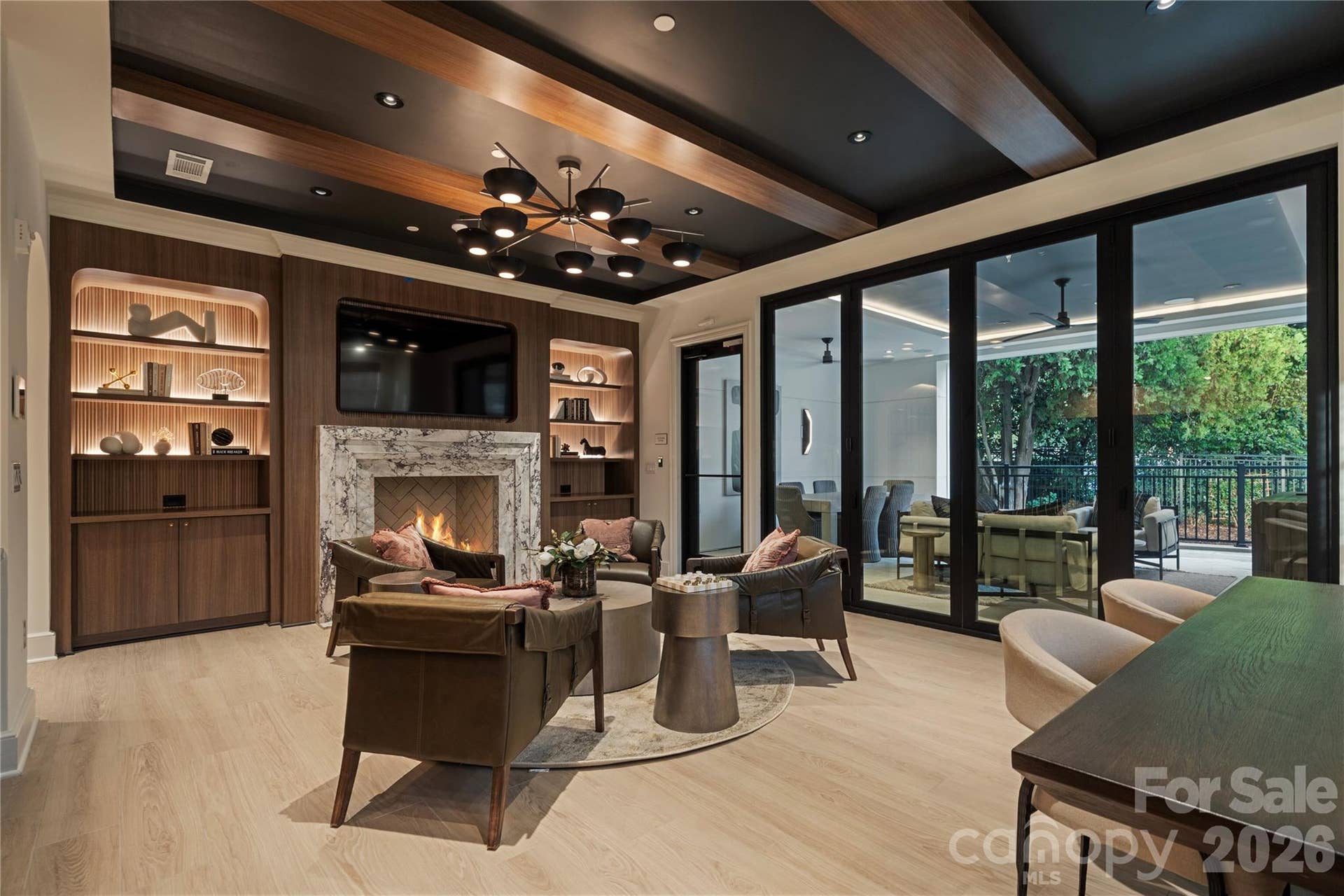 409 Queens Road, #503, Charlotte, NC 28207 Within the larger condominium complex, the sophisticated main floor Residents Club provides a wonderful respite with rich wood finishes, a marble fireplace, built-in bar and direct access to the covered porch and outdoor gathering area.