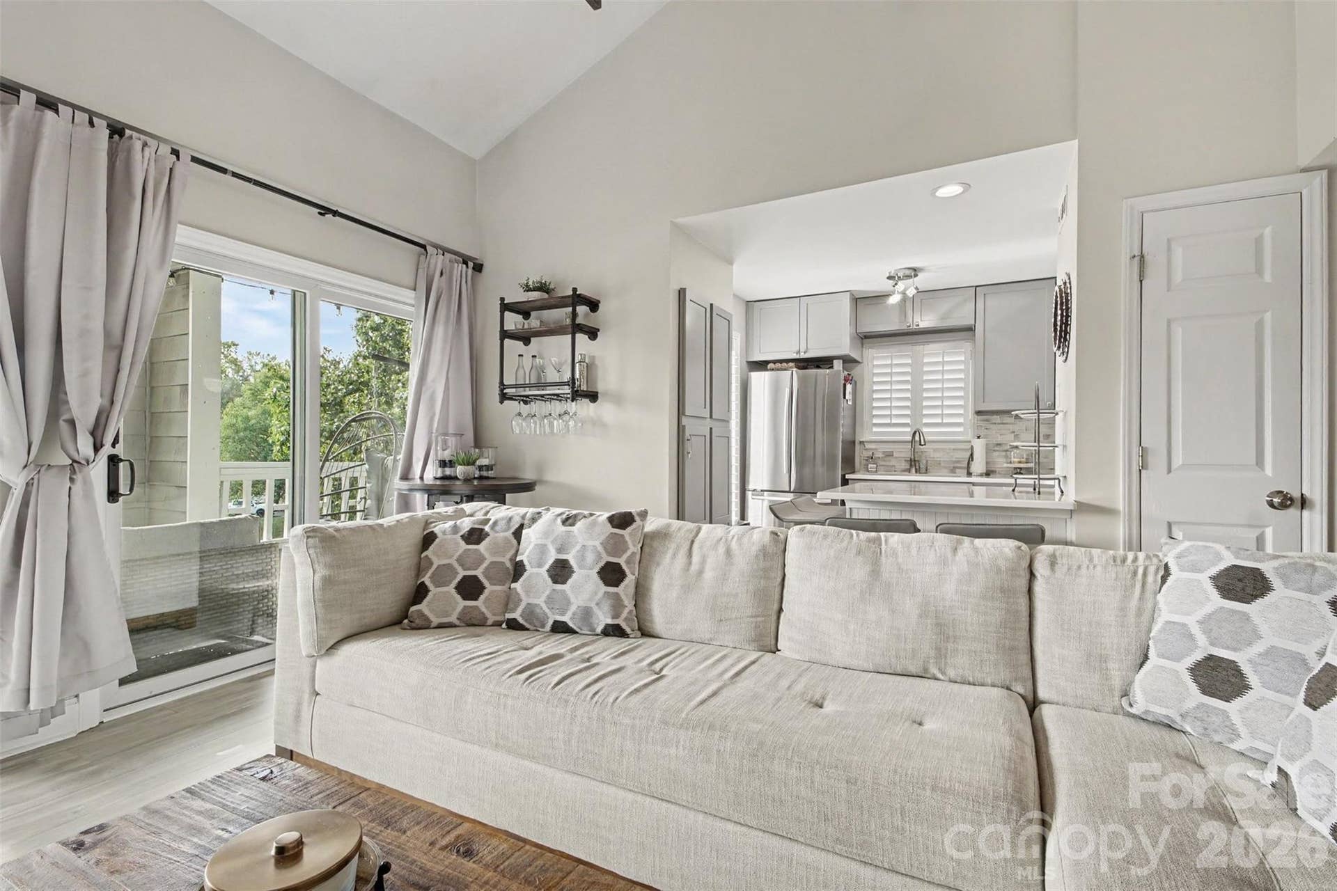 New sliding door with tons of natural light. Plantation shutters throughout home.