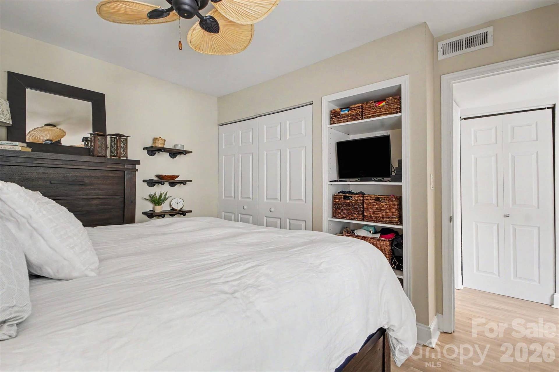 Primary bedroom with built-in storage.