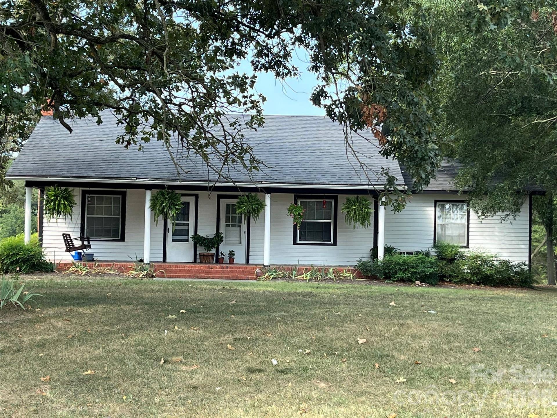Country Charm on approximately 25 acres with beautiful views, mature trees, pond and storage shed