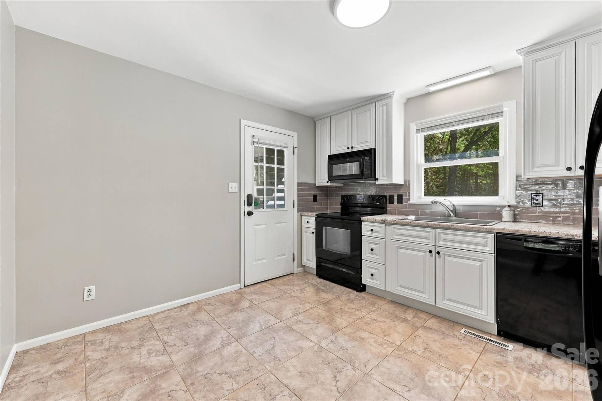 Kitchen with back door entrance