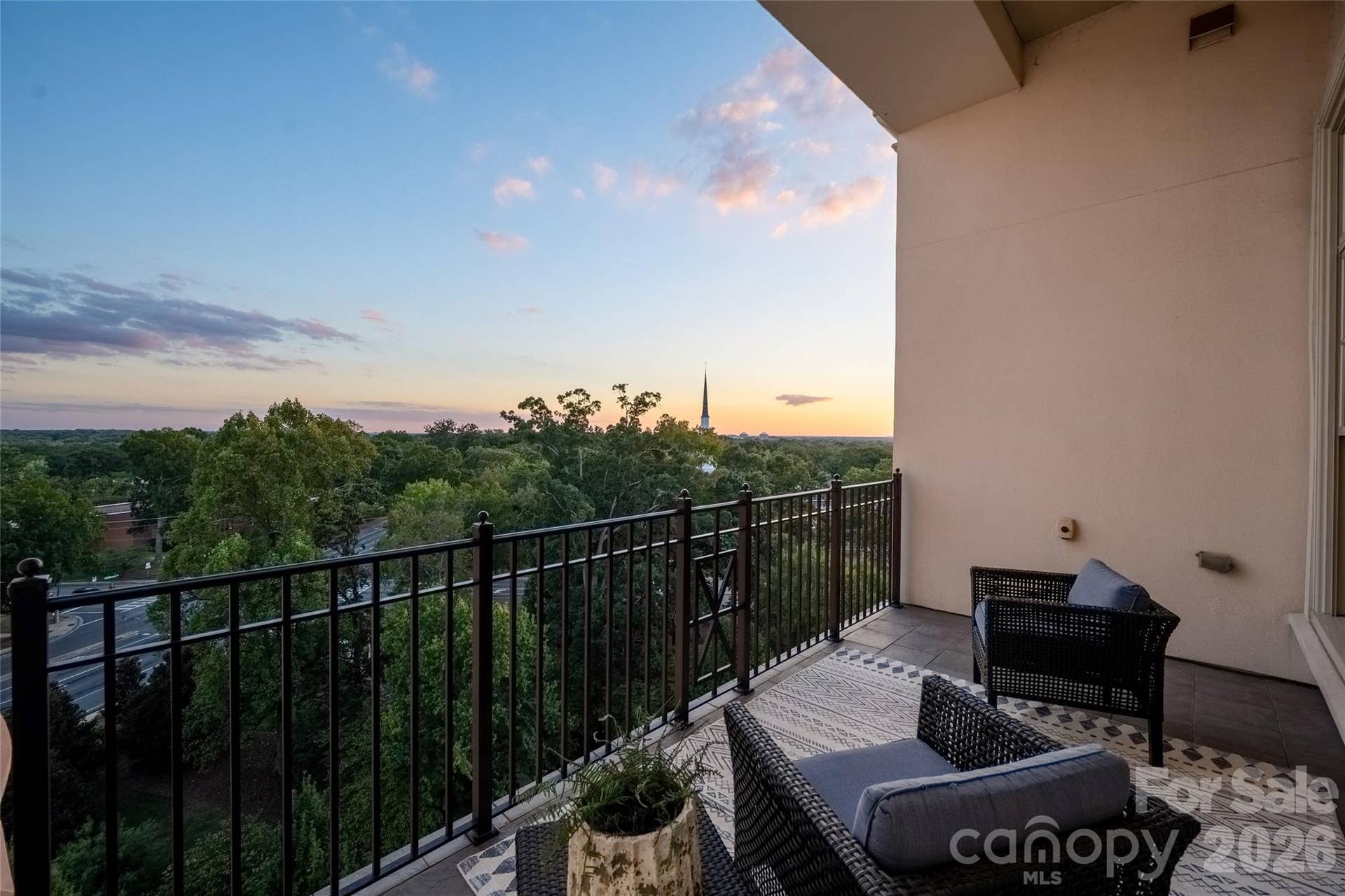 2823 Providence Road, #280, Charlotte, NC 28211 Covered balcony at sunset, steeple on the horizon