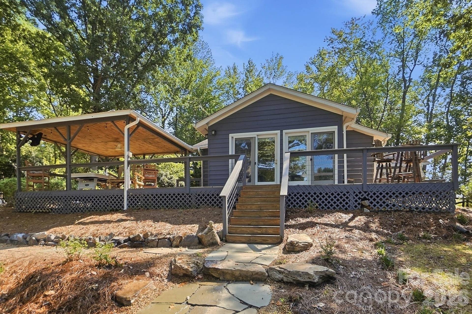 17424 Grasshopper Lane, Charlotte, NC 28278 The huge wrap around deck, covered porch, lakeside decks, floating swim dock, and covered dock with boat lift are all perfect spots for outdoor entertaining or just to relax and take in the amazing views
