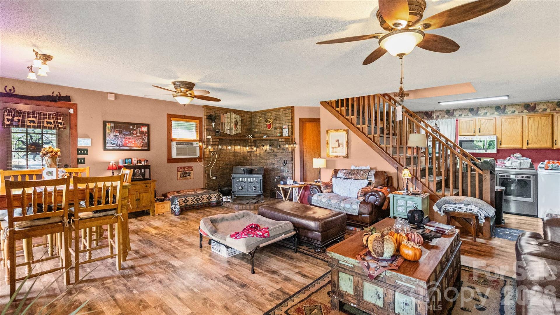 Spacious living room with stone fireplace