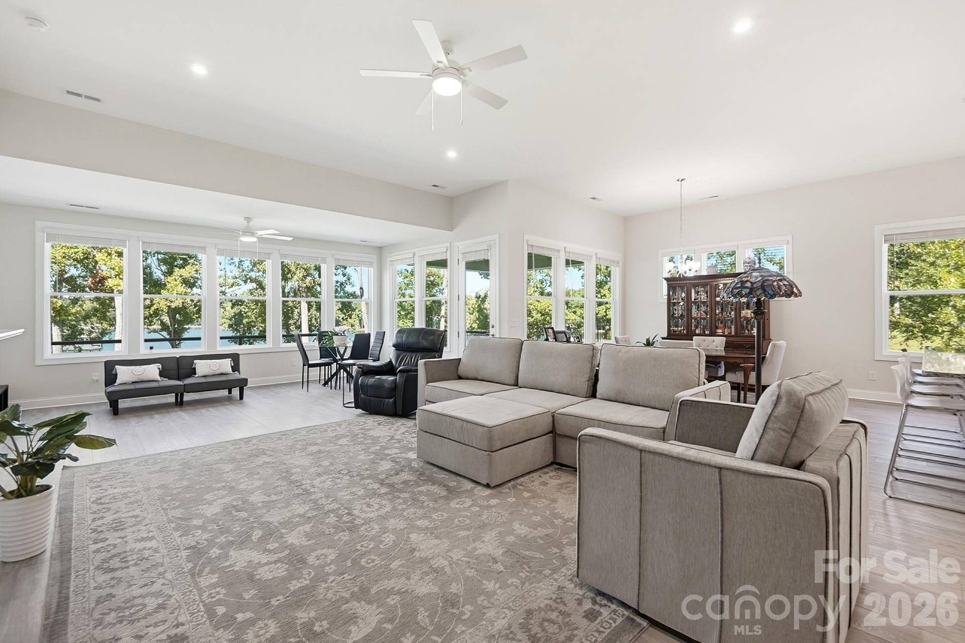 8032 Longwaters Court, York, SC 29745 Framed by stunning lake views, the great room provides easy access to the outdoor living area, creating the perfect setting for relaxing and enjoying the lake