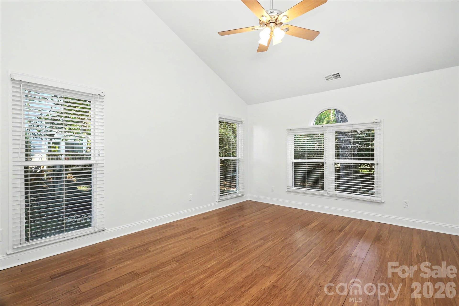 Primary Bedroom with vaulted ceiling