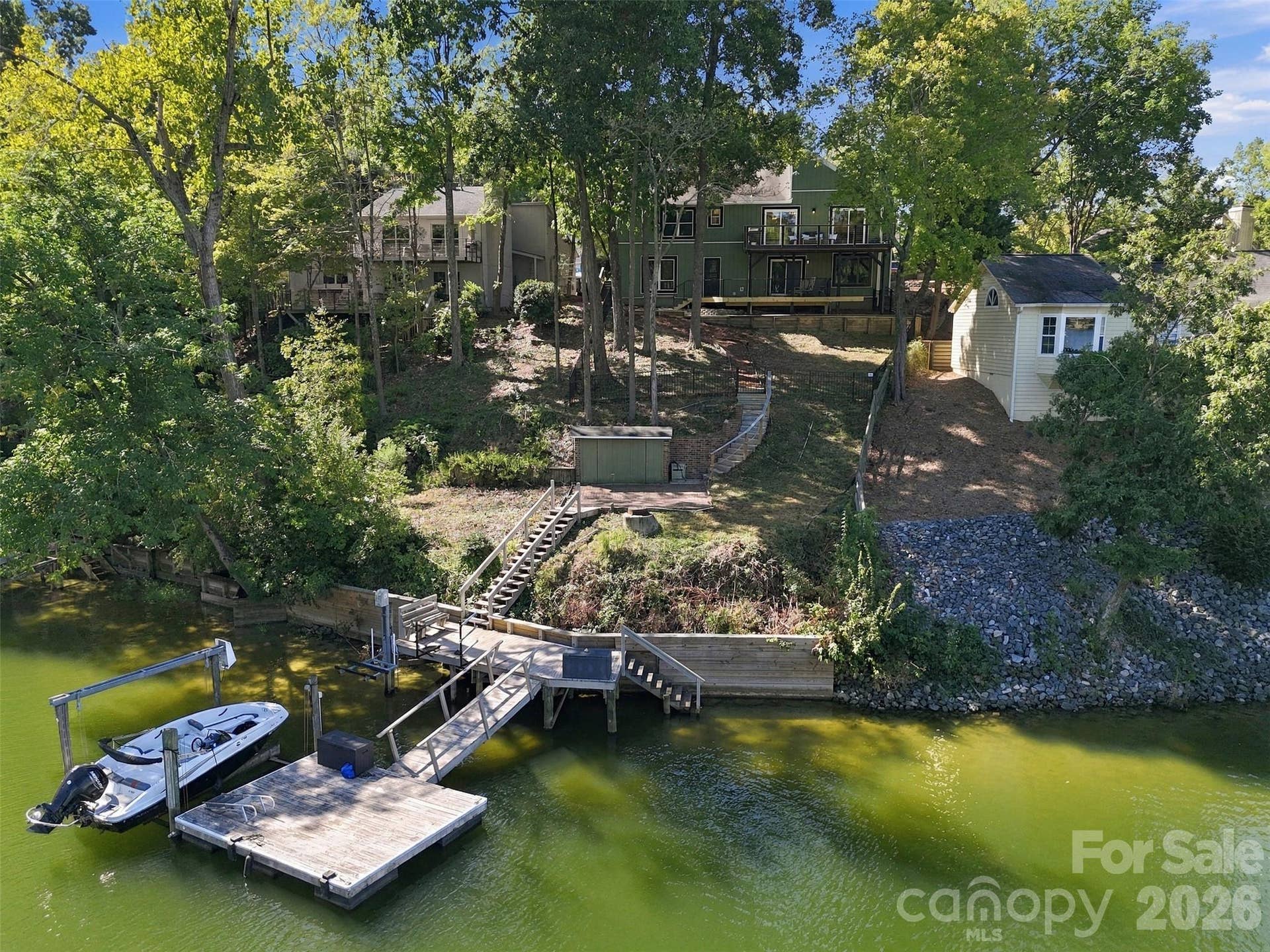 Dock, floating dock, stairs into lake and boat lift