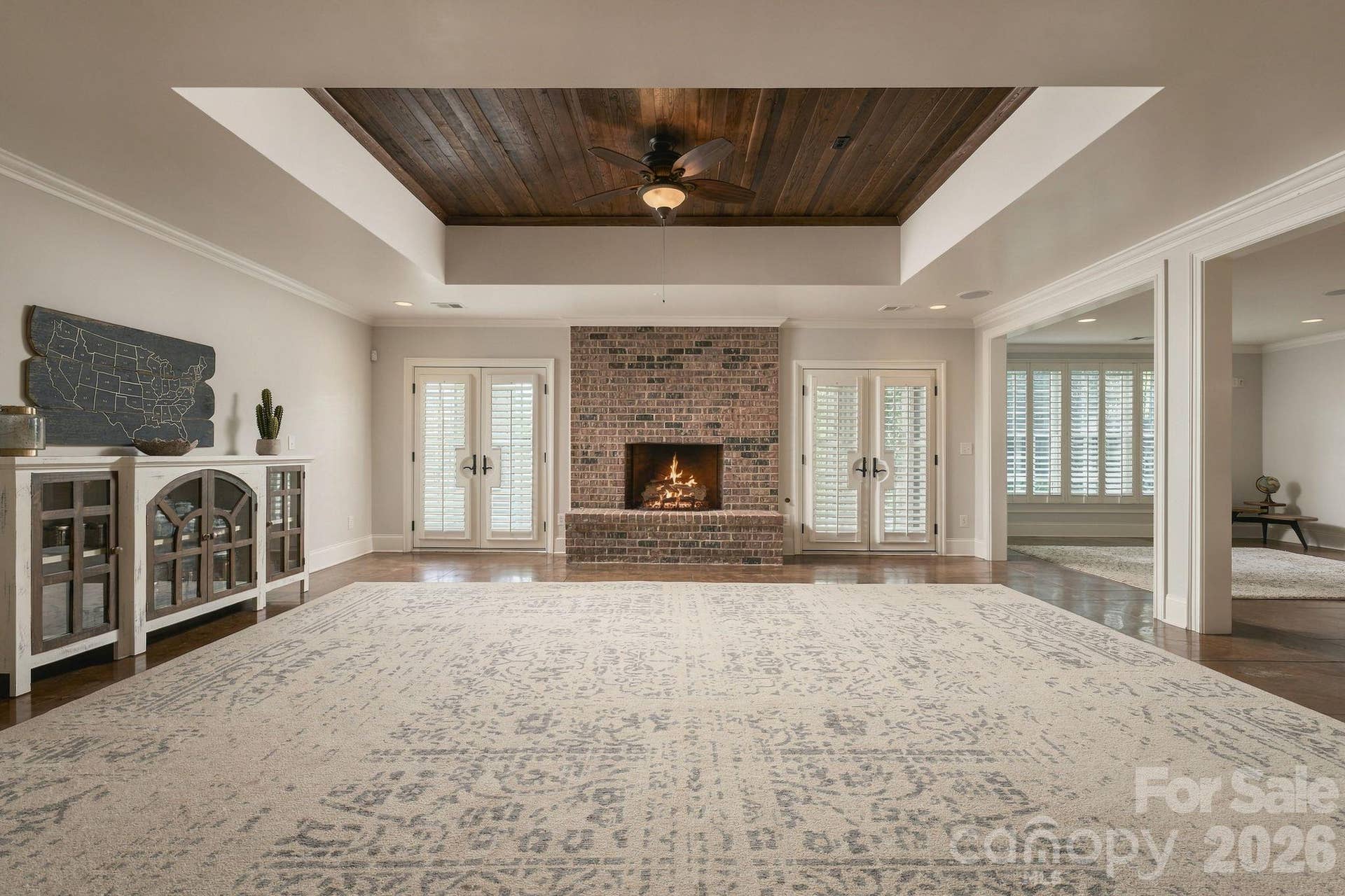 Basement rec room with gorgeous wood details and wood burning fire place