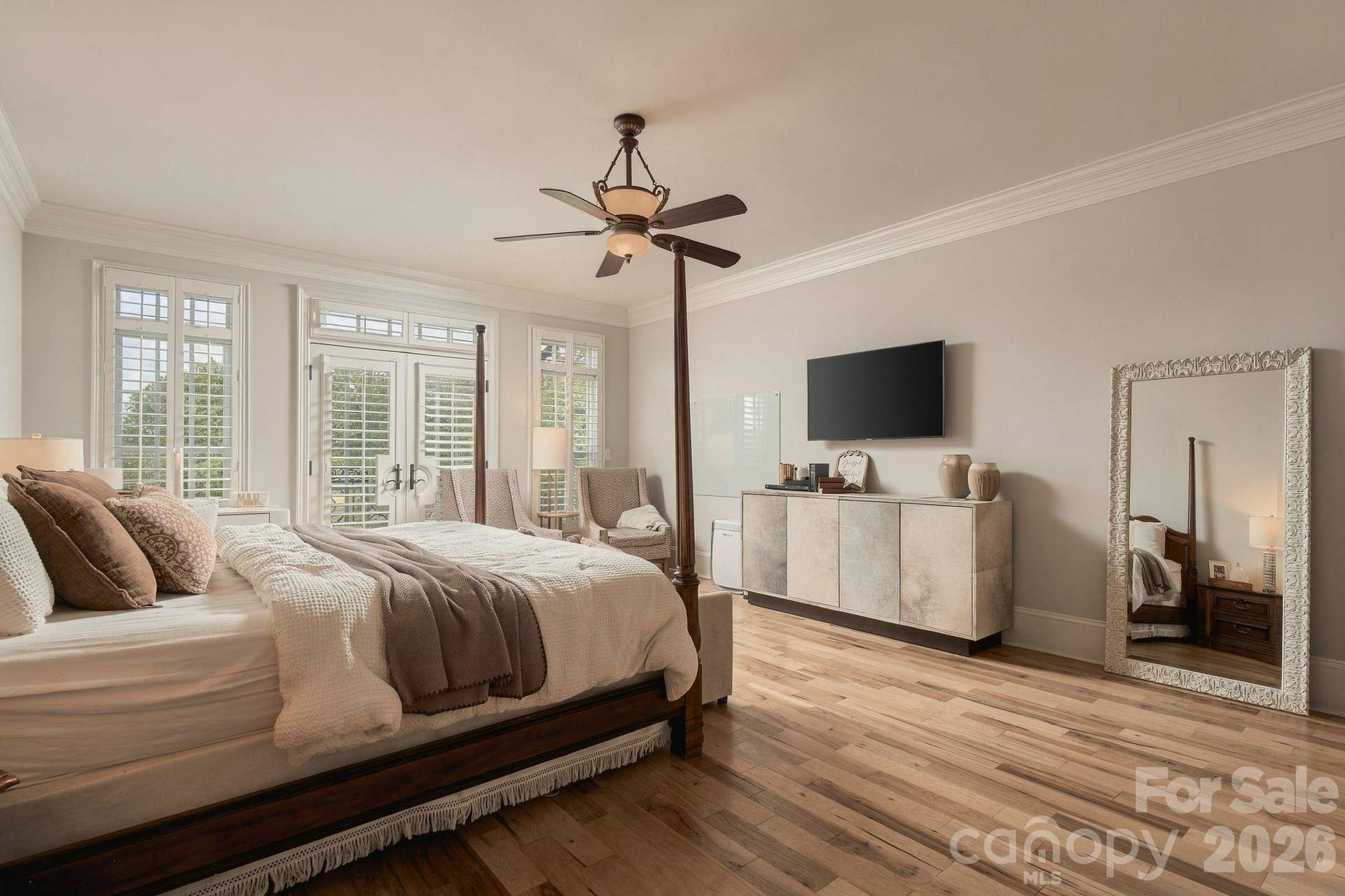 Spacious main level primary bedroom with private balcony