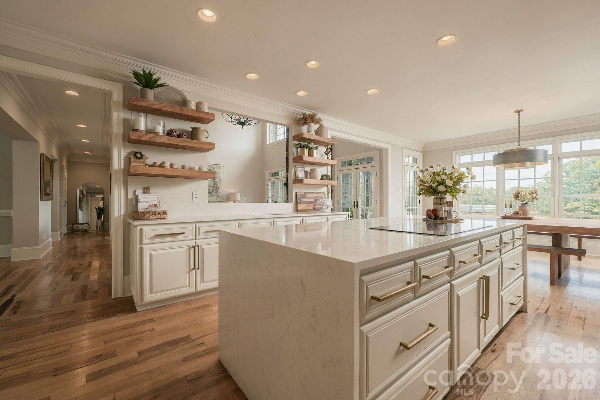 Plenty of kitchen storage & floating shelf accents