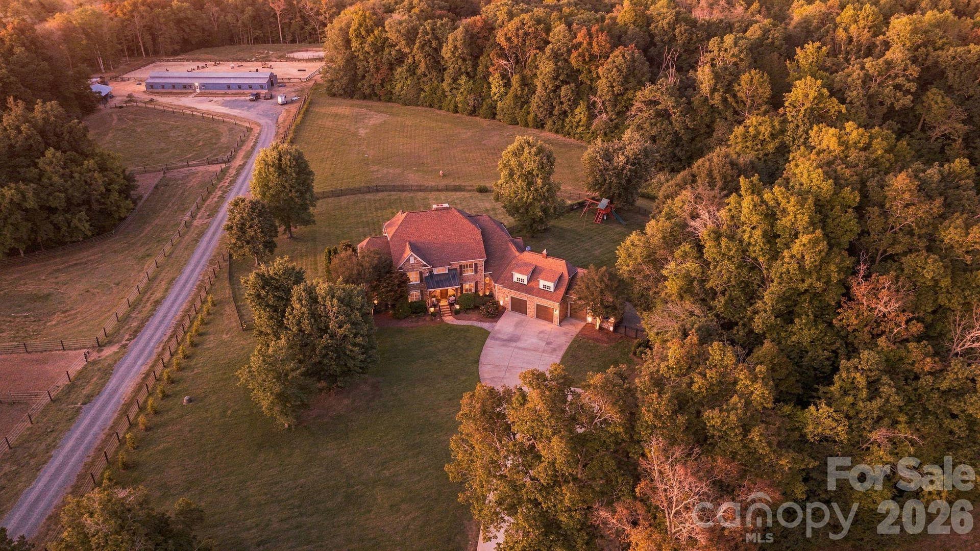 Over 11 acres includes fenced grounds, private stocked pond, woods, and dedicated RV spot with electrical and septic.