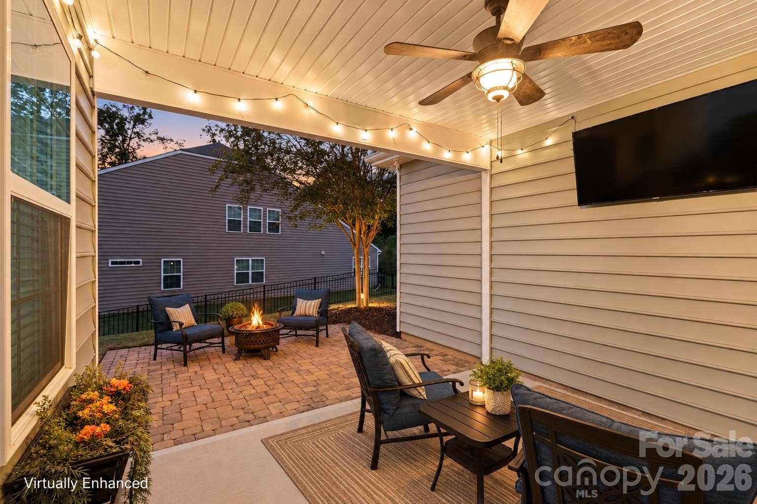 2003 Harvest Time Lane, Waxhaw, NC 28173 A backyard made for cozy nights by the fire pit, weekend gatherings, and relaxing under the covered patio.