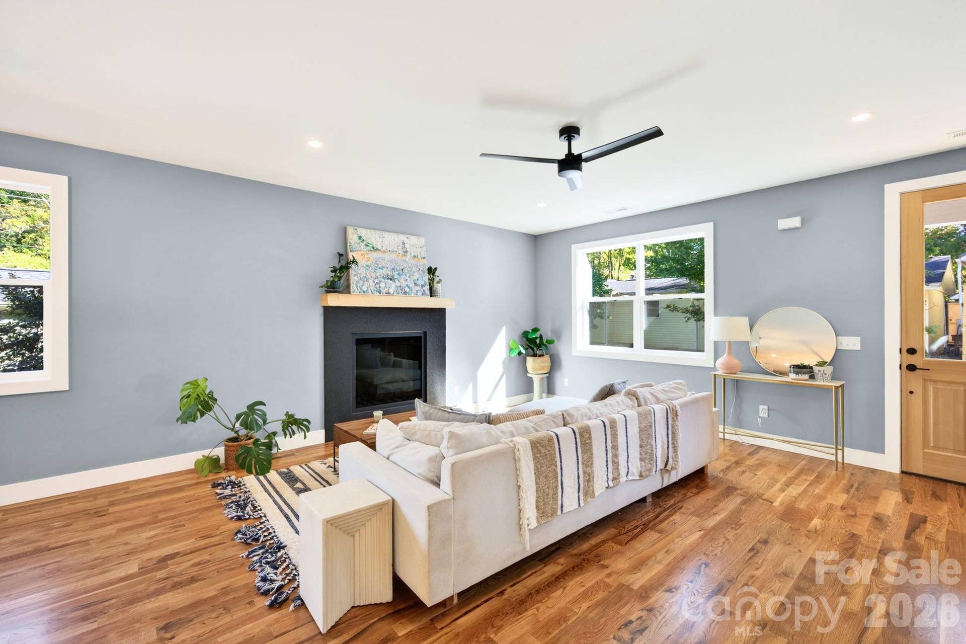 Living Room with Granite Tile-Surround Fireplace