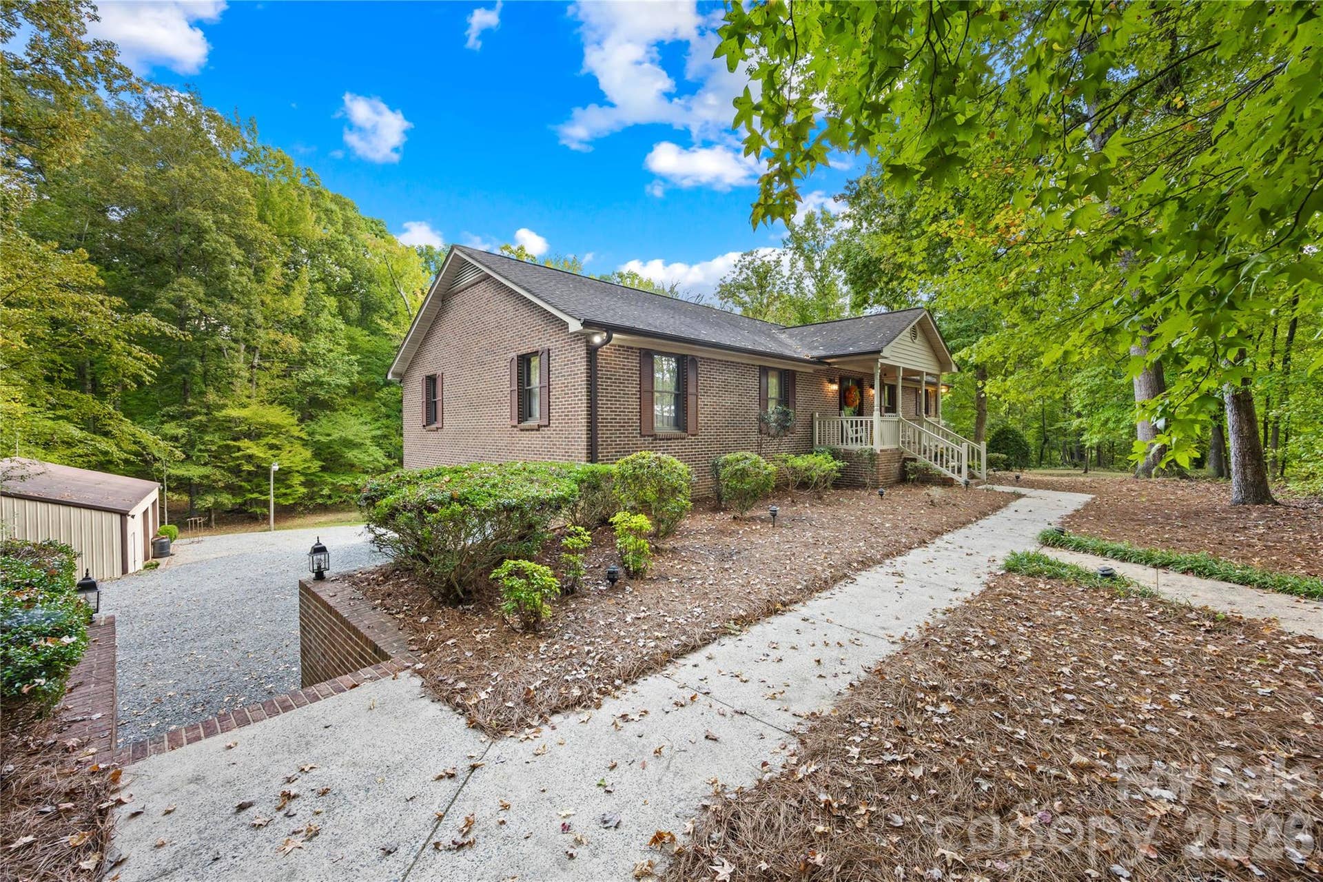 16208 Deepwood Place, Indian Trail, NC 28079 sidewalk to front door and garage