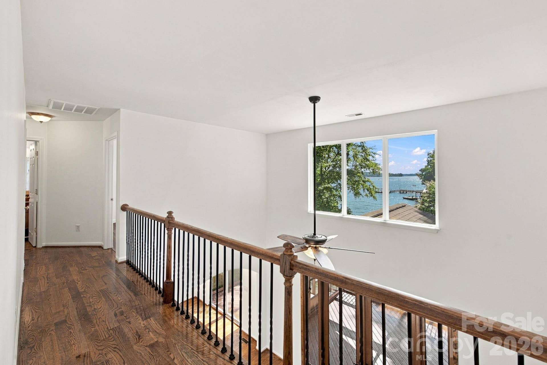 Hallway from upper level primary to additional bedrooms