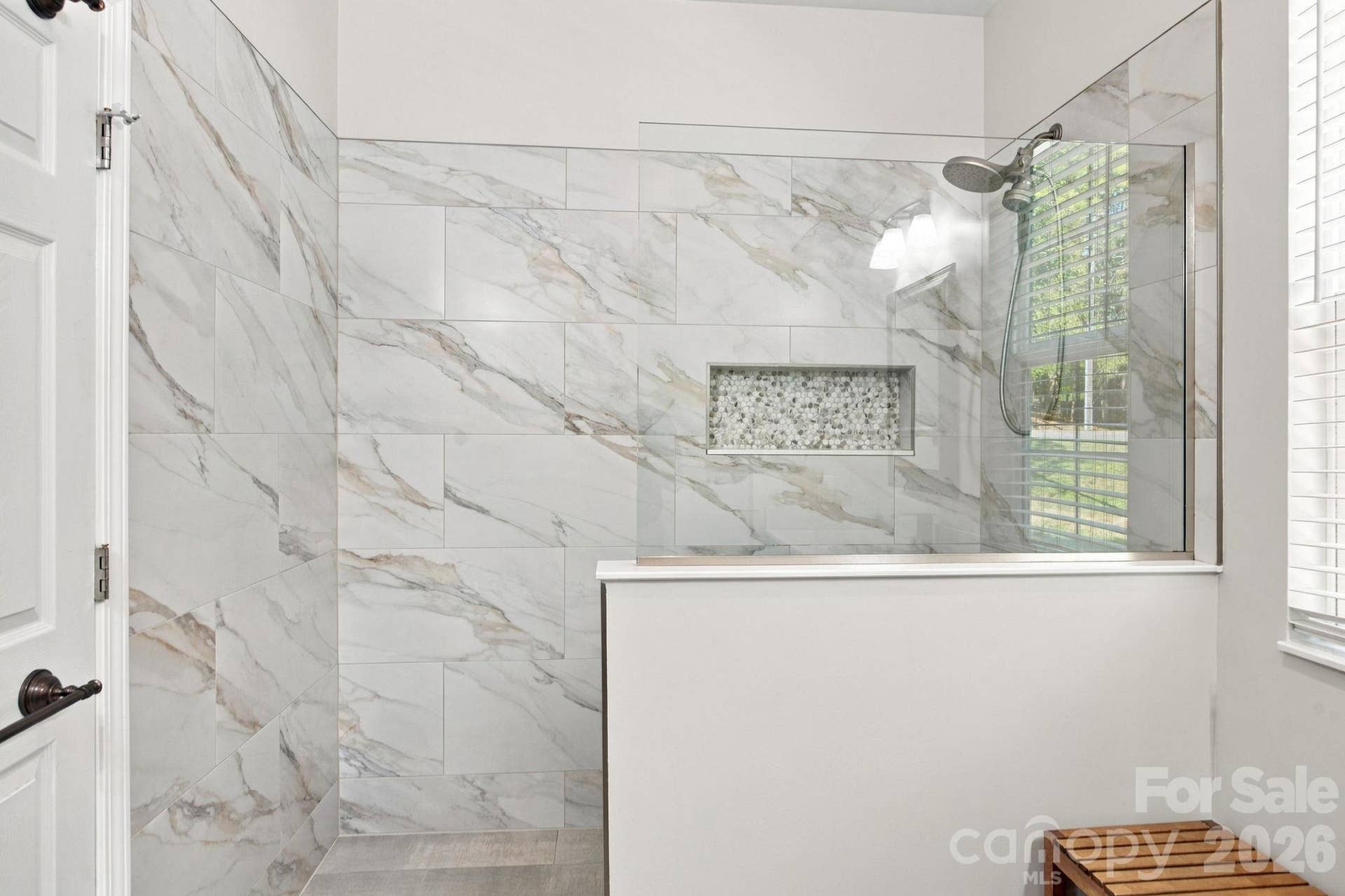 Walk-in shower main level primary suite