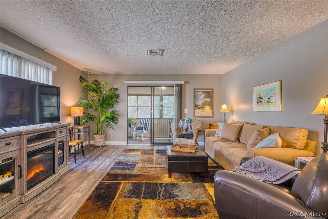23 Dogwood Drive, Homosassa, FL 34446 TV Console includes a remote controlled electric fireplace with heater if you want to take the chill off or just look at the fire.