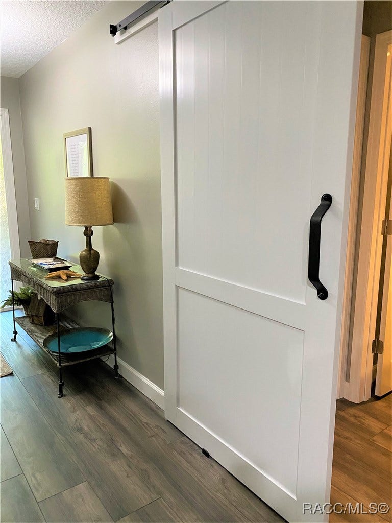 23 Dogwood Drive, Homosassa, FL 34446 This Sliding Barn Door Provides Privacy for the Queen Master Suite with full bath.