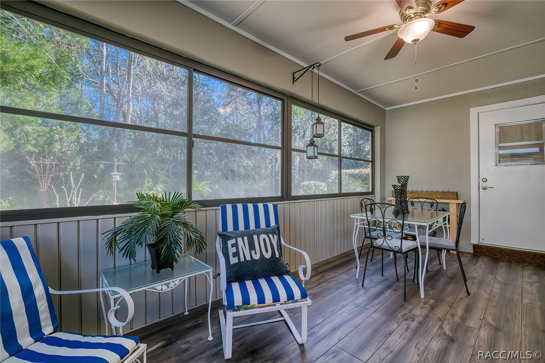 23 Dogwood Drive, Homosassa, FL 34446 Lanai with screens and vinyl windows that can be opened in nice weather. Leave the sliding doors open for AC/Heat or there is a small electric heater for those chilly nights.