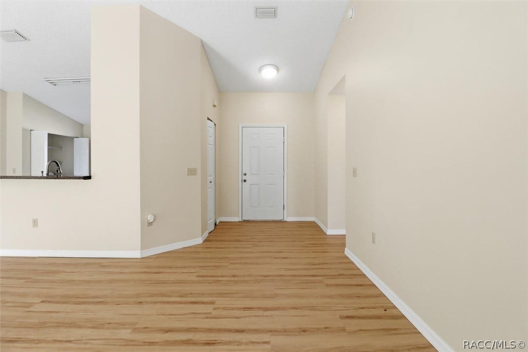 966 W Starjasmine Place, Beverly Hills, FL 34465 Foyer with storage closet