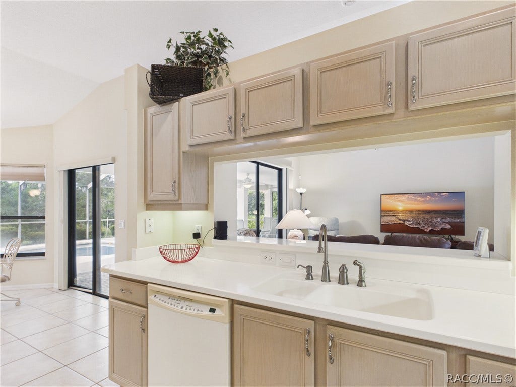 10 Rudbeckia Court, Homosassa, FL 34446 KITCHEN 1 HAS DUAL SINKS ND OPENS TO THE GREAT ROOM