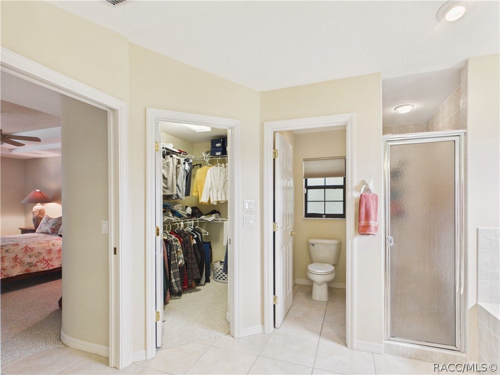 10 Rudbeckia Court, Homosassa, FL 34446 WALK IN CLOSET, SEPARATE TOILET AND GLASS DOOR SHOWER