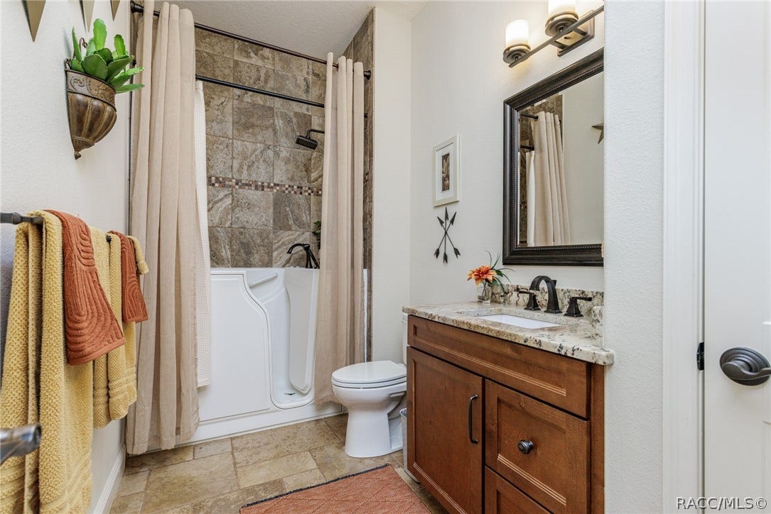 4750 W Mohawk Drive, Beverly Hills, FL 34465 guest bath with walk in tub