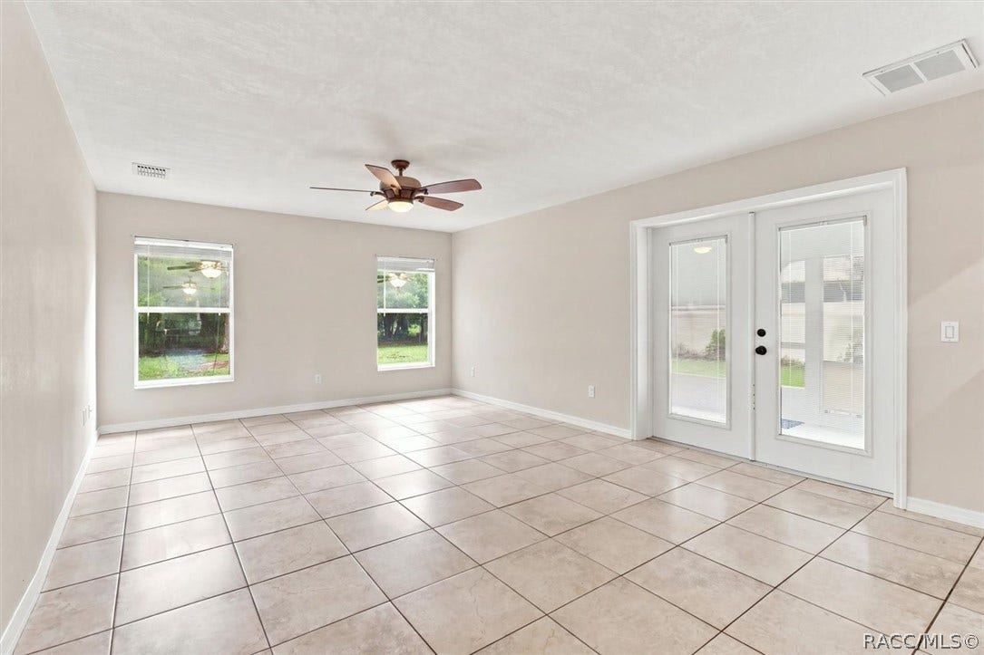 4051 S Winding Oaks Drive, Homosassa, FL 34446 Family Room with french doors to screened-in porch