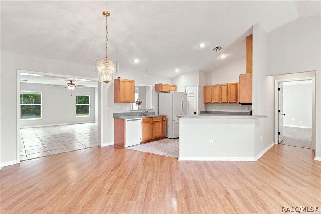 4051 S Winding Oaks Drive, Homosassa, FL 34446 Dining area and view of kitchen