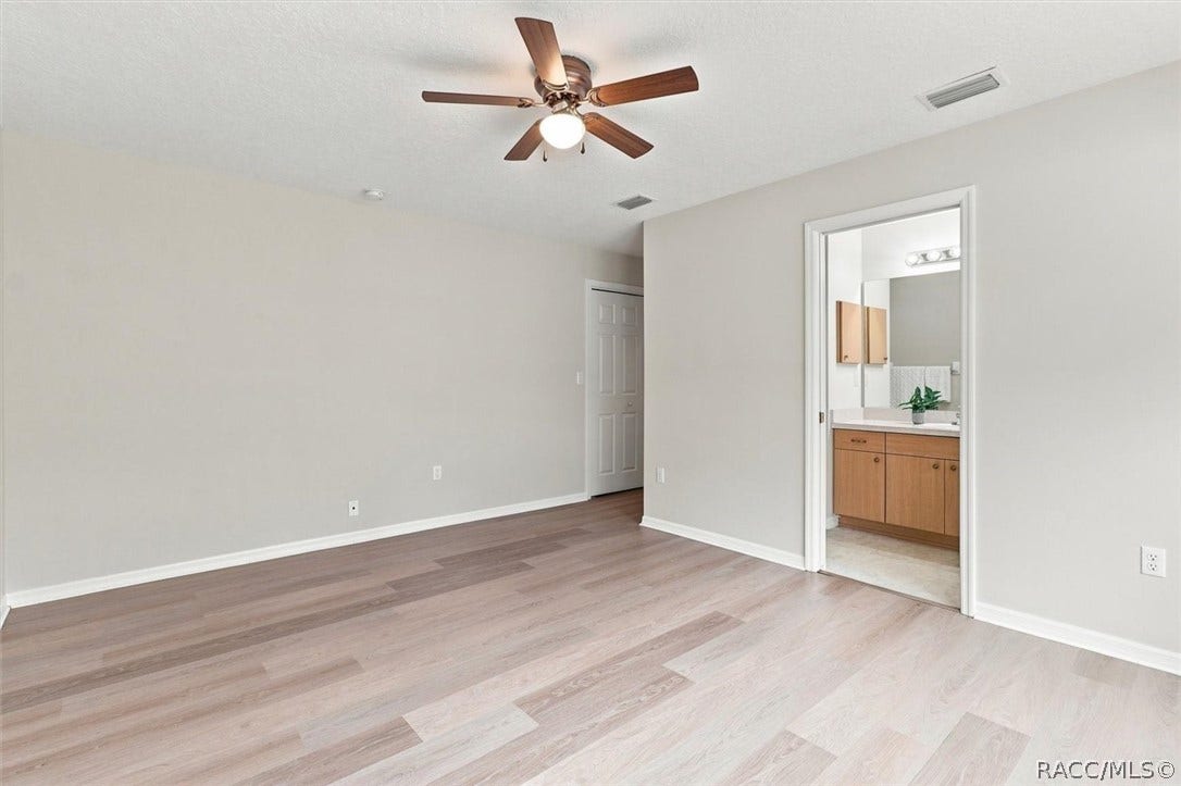 4051 S Winding Oaks Drive, Homosassa, FL 34446 Primary bedroom w/ ensuite