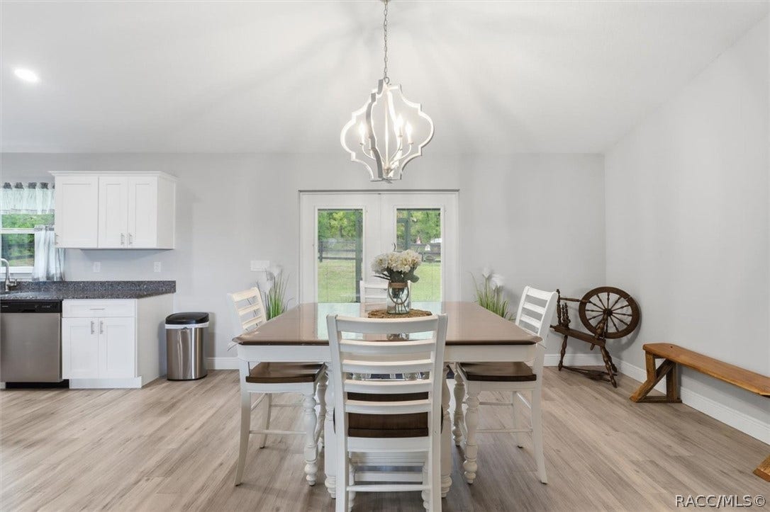 Dining area with French doors to the screened lanai