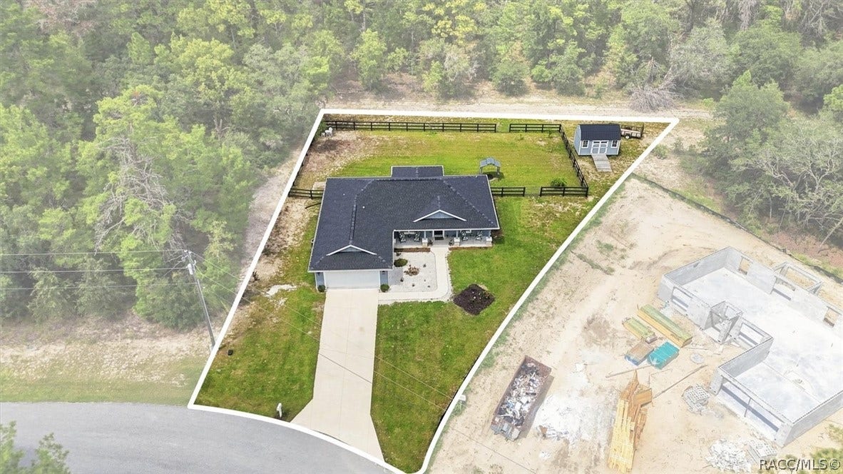 Aerial view of property.  Note front and rear access gates in fencing.