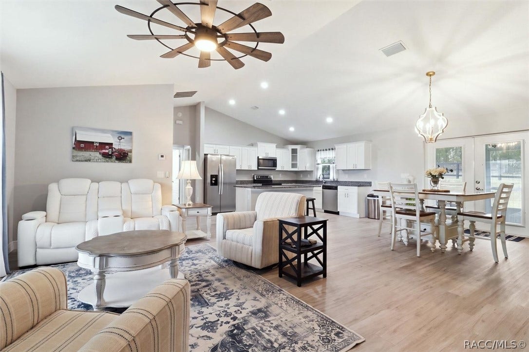 Open floor plan:  living and dining areas, and kitchen