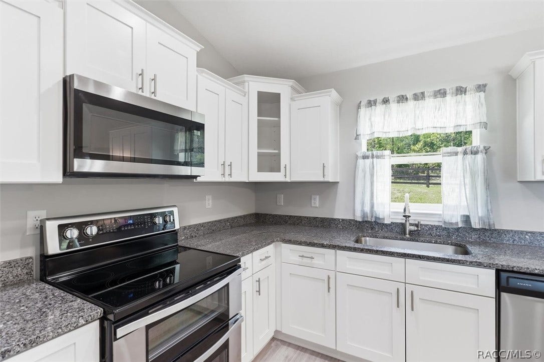 Corner cabinet with glass door is a custom touch