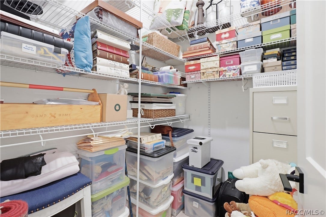4124 W Pine Ridge Boulevard, Beverly Hills, FL 34465 WALK-IN STORAGE ROOM
Storage is definitely not an afterthought! This dedicated walk-in storage room features extensive wraparound wire shelving w/ multiple levels of organized space for household supplies, keepsakes, seasonal dcor, files, crafts & more.