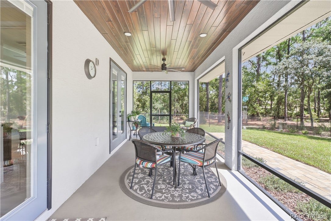 4124 W Pine Ridge Boulevard, Beverly Hills, FL 34465 SCREENED LANAI This is where morning coffee belongs! Generously sized screened lanai features a beautiful wood-plank ceiling, recessed lighting, ceiling fan & plenty of room for outdoor dining and conversation areas while enjoying the private backyard.