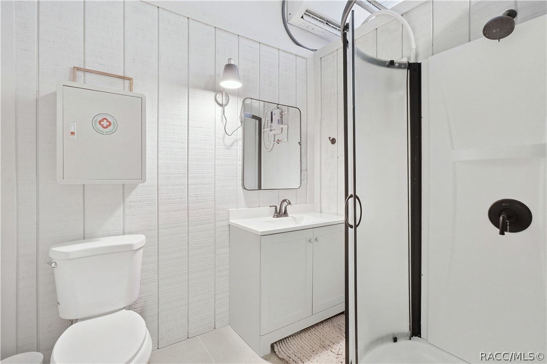 4124 W Pine Ridge Boulevard, Beverly Hills, FL 34465 DETACHED GARAGE FULL BATH
A fantastic bonus inside the detached garageits own full bathroom! Features a walk-in shower w/ rainfall-style showerhead & dark fixtures, vanity w/ storage, mirror, toilet & wall-mounted lighting. A great addition for a workshop, hobby area or future flex-space possibilities.