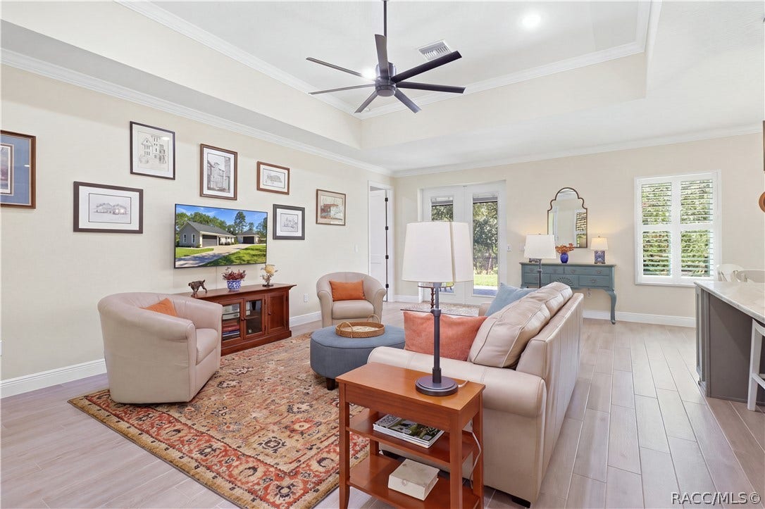 4124 W Pine Ridge Boulevard, Beverly Hills, FL 34465 LIVING AREA Generous great room combines high ceilings, crown molding, recessed lighting, neutral finishes & plantation shutters for a bright, refined feel.
