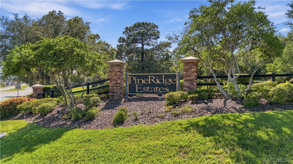 4124 W Pine Ridge Boulevard, Beverly Hills, FL 34465 PINE RIDGE ESTATES ENTRANCE FROM CR 491
Entrance to Pine Ridge Estates from CR 491, featuring the communitys distinctive monument signage, brick columns, black rail fencing & beautifully maintained landscapingan attractive gateway into the community.