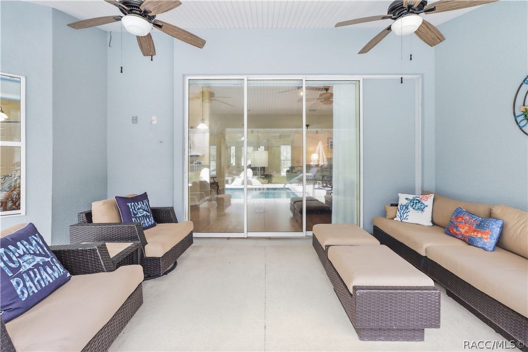 2593 S Columbine Avenue, Homosassa, FL 34448 Covered Lanai Additional view highlighting the generous covered entertaining space and direct access to the home and pool area.