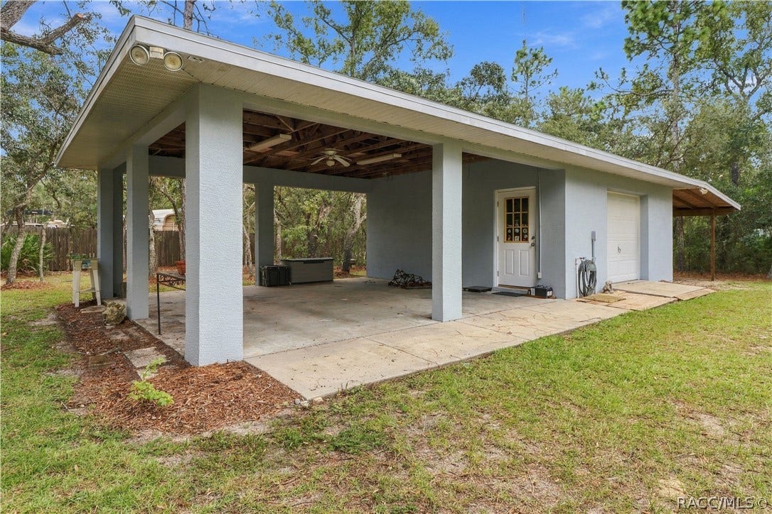 2593 S Columbine Avenue, Homosassa, FL 34448 DETACHED 20x20 GARAGE + 2 COVERED CARPORTS + POLE BARN Versatile detached garage/workshop with an oversized covered area for additional parking, equipment or outdoor projects. BRING YOUR TOYS!