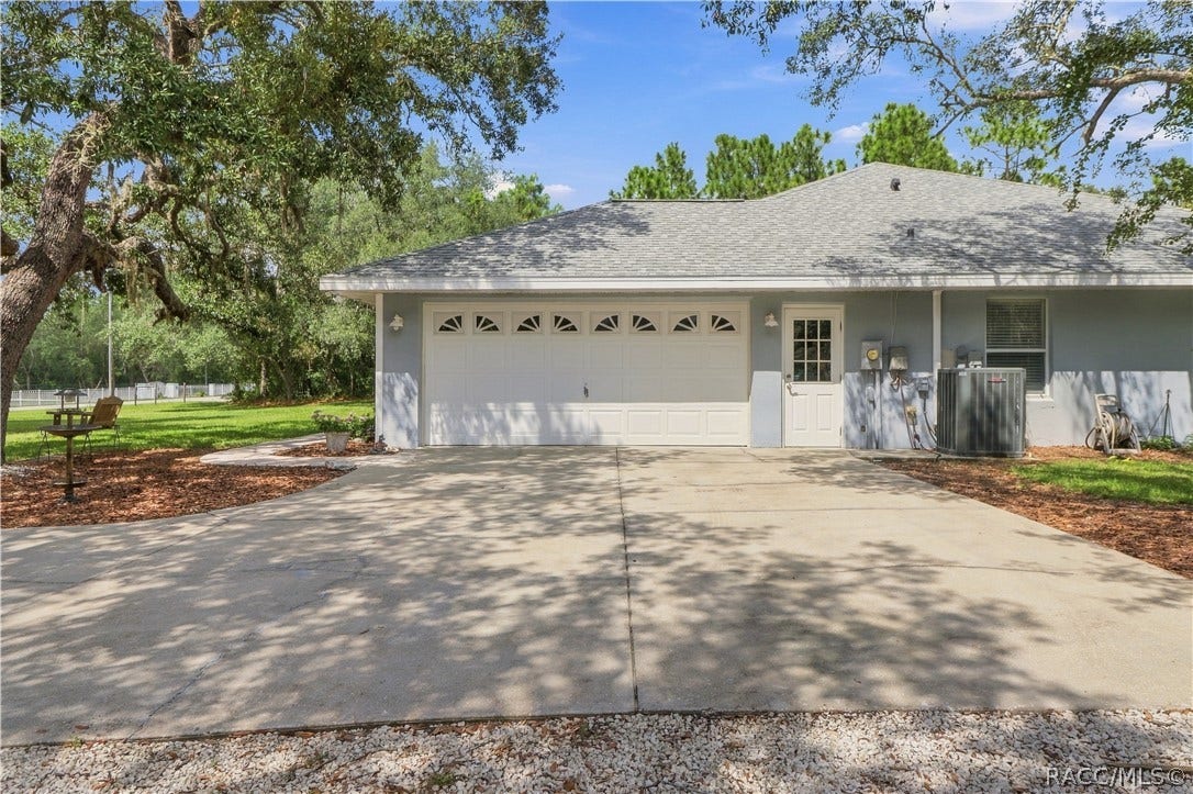 2593 S Columbine Avenue, Homosassa, FL 34448 Attached Garage BRAND NEW ROOF 2026 Attached 2-car garage with generous driveway space, side entry.