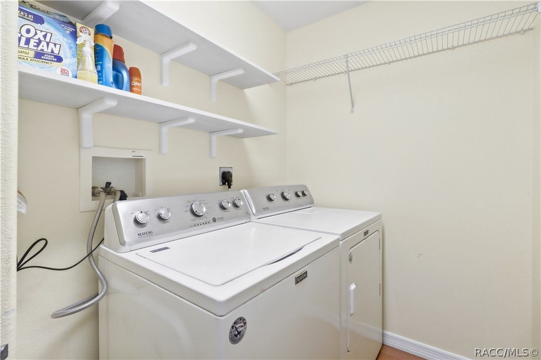 2593 S Columbine Avenue, Homosassa, FL 34448 Indoor Laundry Room Dedicated laundry area with washer and dryer, shelving and additional storage space.