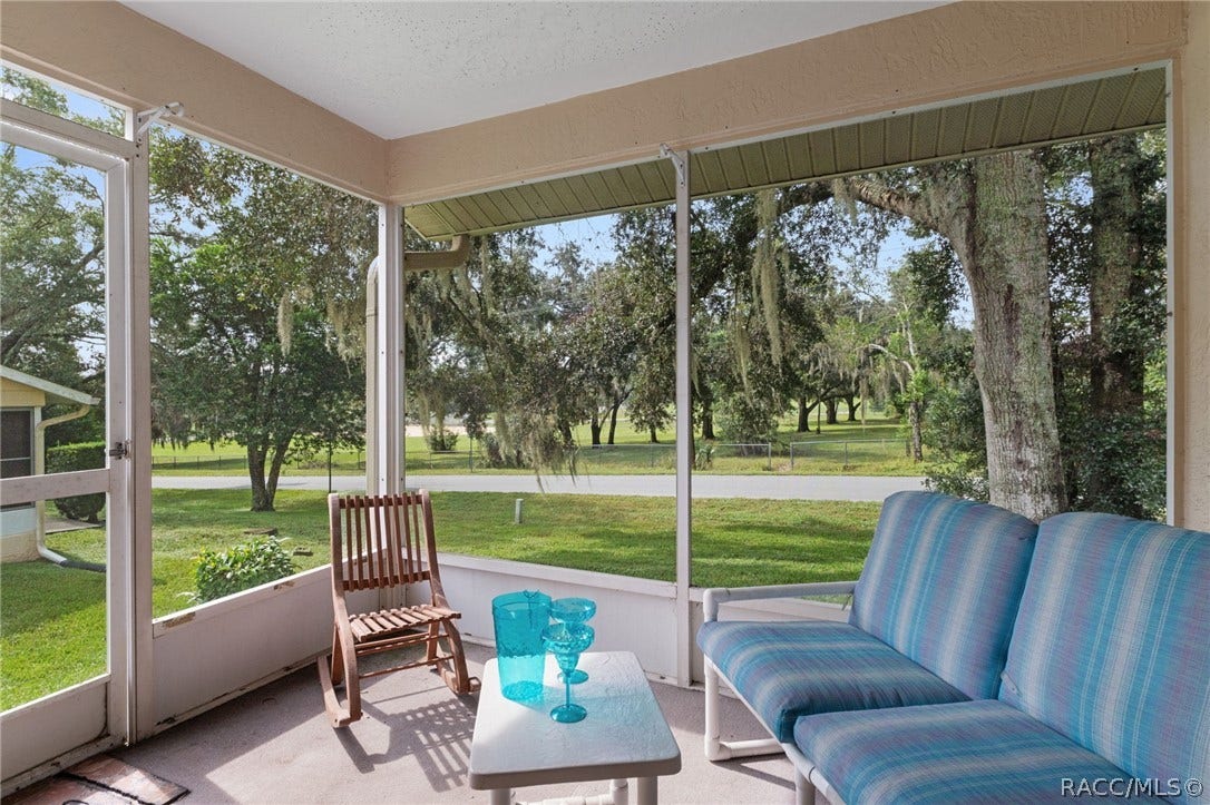 Back screened porch with views of the Park