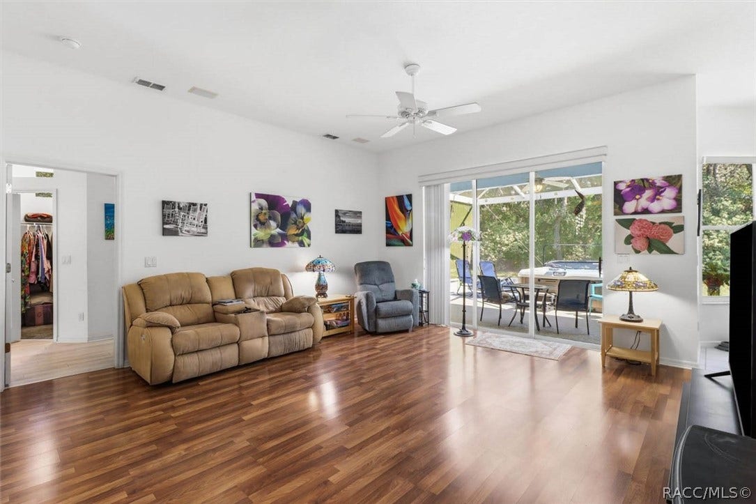 80 Oak Village Boulevard, Homosassa, FL 34446 Living area with Triple pocket sliders