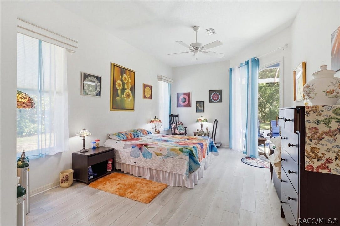 80 Oak Village Boulevard, Homosassa, FL 34446 Primary bedroom with sliders to lanai